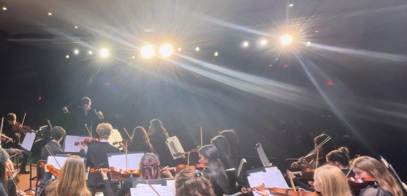 Sun Shin conducting an orchestra performance